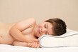 © Zarina Lukash - A 5-year-old boy lies on a children's orthopedic pillow made of memory foam