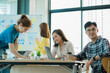 © ArLawKa - Young business finance teams in Asia work together in project brainstorming sessions. plan a strategy small start up company or office collaboration ideas