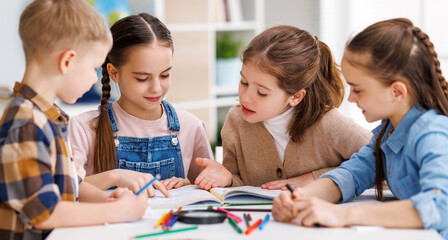 Diligent girl speaking with classmates