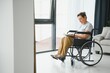 © Serhii - middle aged woman sitting on wheelchair