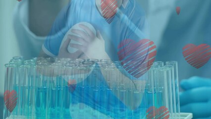 Poster - Animation of heart icons over caucasian scientist with pipette