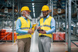 © ivanko80 - Two employees with tablet at logistics center warehouse