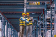 © ivanko80 - Two employees with tablet at logistics center warehouse