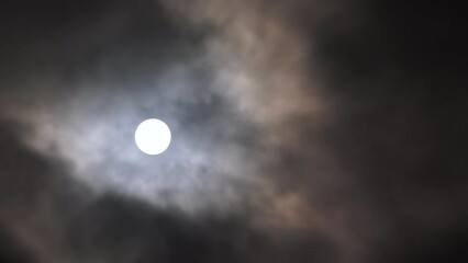 Wall Mural - Real time clouds passing the night sky with full shining moon glowing bright.