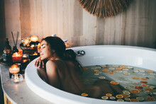 Beautiful Woman Relaxing At Spa. Young Lady Relaxing In Jacuzzi.