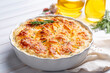 © Esin Deniz - Potato gratin - graten (baked potatoes with cream and cheese) with rosemary and forks (Turkish name; Kremali patates)