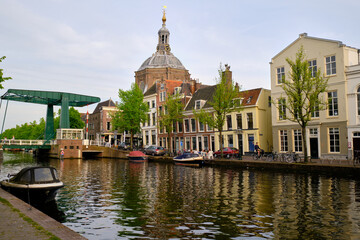 Leiden, The Netherlands 09 May 2022. The Oude Vest canal, traditional houses and Marekerk Protestant church.