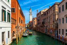 Canal And Old Typical Houses In Venice, Italy.