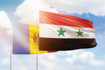 Sunny blue sky and flags of syria and moldova