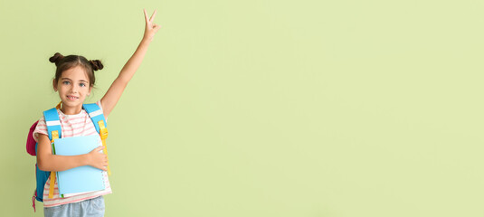 Canvas Print - Happy little schoolgirl on color background with space for text