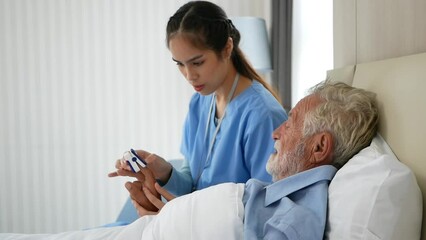 medical workers check oxygen for elderly male patients with new oxygen monitors during the coronavir