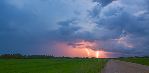 Wall Mural - Landscape with lightning at sunset light, panoramic landscape