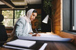 © Jacob Lund - Creative Muslim designer working with drawings in an office