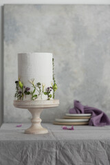 Canvas Print - White wedding cake with lillac and green flowers