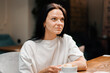© Guys Who Shoot - The girl drinks coffee in the company of cheerful friends who communicate on weekends and spend time together at lunch in the dining room. Meeting in a public place. Friendship.