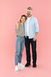 © Prostock-studio - Loving Middle Aged Couple Embracing Standing Over Pink Background