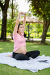 © Yellow Boat - Pregnant woman touching belly in the City Park, Pregnant Relaxing and exercise, Beautiful tender mood photo of pregnancy