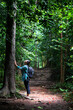 Woman with backpack exploring the beautiful rain forest on Sub madue Petchabun Thailand. Travel and ecotourism concept