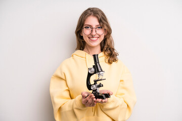 teenager girl. scientist student with a microscope