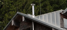 New Stainless Steel Chimney On A House