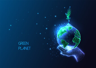 Wall Mural - Concept of environmental social responsibility with hand holding Earth globe and sprout on dark blue