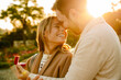 © Drobot Dean - White man smiling and proposing to his girlfriend in park