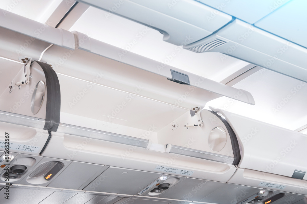 Overhead compartment plane . Luggage rack open overhead. Stock Photo ...