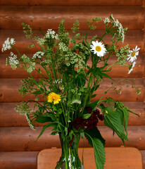 Wall Mural - a bouquet of flowering garden weeds - daisies, dandelions, snyt and grasses in a transparent glass v
