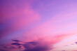 Purple sky background with clouds at sunset on a summer evening
