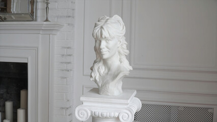 White marble head of young woman. Clip. Sculpture of a female head