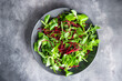 beet salad green leaves mix beetroot, mache leaves, cress fresh healthy meal food snack diet on the table copy space food background rustic  