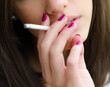 © Solid photos - Young woman smoking cigarette