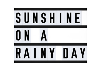 Sunshine On A Rainy Day saying on vintage retro quote board. Poster
