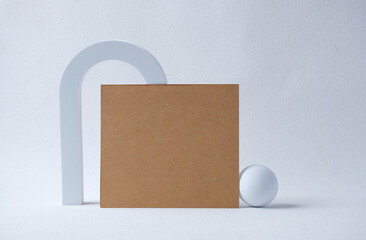 Poster - mockup blank Kraft business card on white block with sunlight