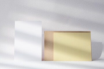 Leinwandbilder - blank poster card with product display stand with sunlight in white studio