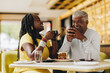 © Jacob Lund - Happy senior couple having coffee together in a cafe