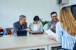 © bnenin - Business people at the meeting room, working together, talking.