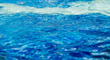 Fototapeta Tęcza - surface of water, blue wave background
