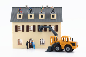 Wall Mural - Miniature scene house demolition on white background