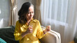 © Prathankarnpap - Asian middle aged woman holding pills and glass of fresh water. Elderly healthcare, pharmaceutical healthcare treatment concept
