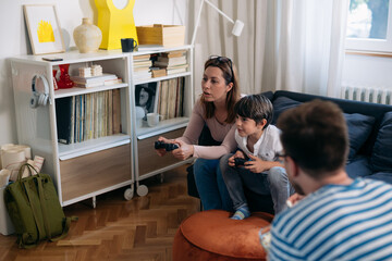 Wall Mural - family enjoying time playing video games at home