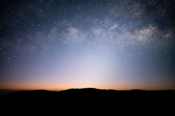 Wall Mural - Beautiful view on top of the mountain, night sky, star and Milky Way over the sky.