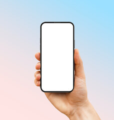 Wall Mural - frameless smartphone with a blank screen in hand on a blue-to-pink gradient