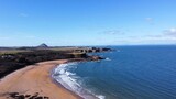 Fototapeta Na ścianę - Aerial view of the sea and rocky coastline on the East coast of Scotland. 