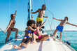 © DisobeyArt - Happy friends having fun on sailing boat outdoor - Focus on african man face - Travel, summer and vacation concept