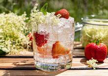 Summer Lemonade Is Made From Elderflower Cordial And Strawberry. A Cold Refreshing Drink In The Sunny Garden. Close Up.