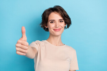 Sticker - Photo of lovely cheery woman show you thumb up give compliment promote product isolated on blue color background