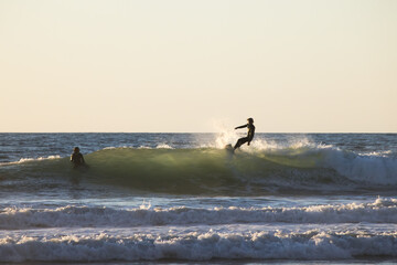 Wall Mural - A surfer in the sunset light