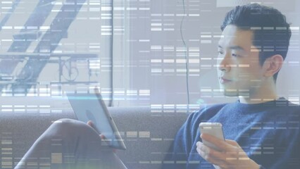 Poster - Mosaic squares against asian man using smartphone and digital tablet sitting on the couch
