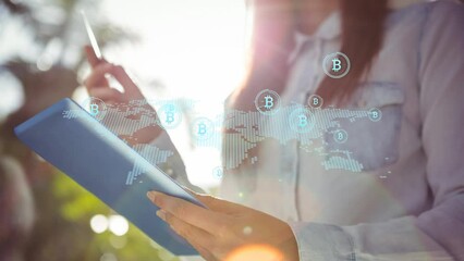 Poster - Multiple bitcoin symbols floating over world map against mid section of a woman using digital tablet